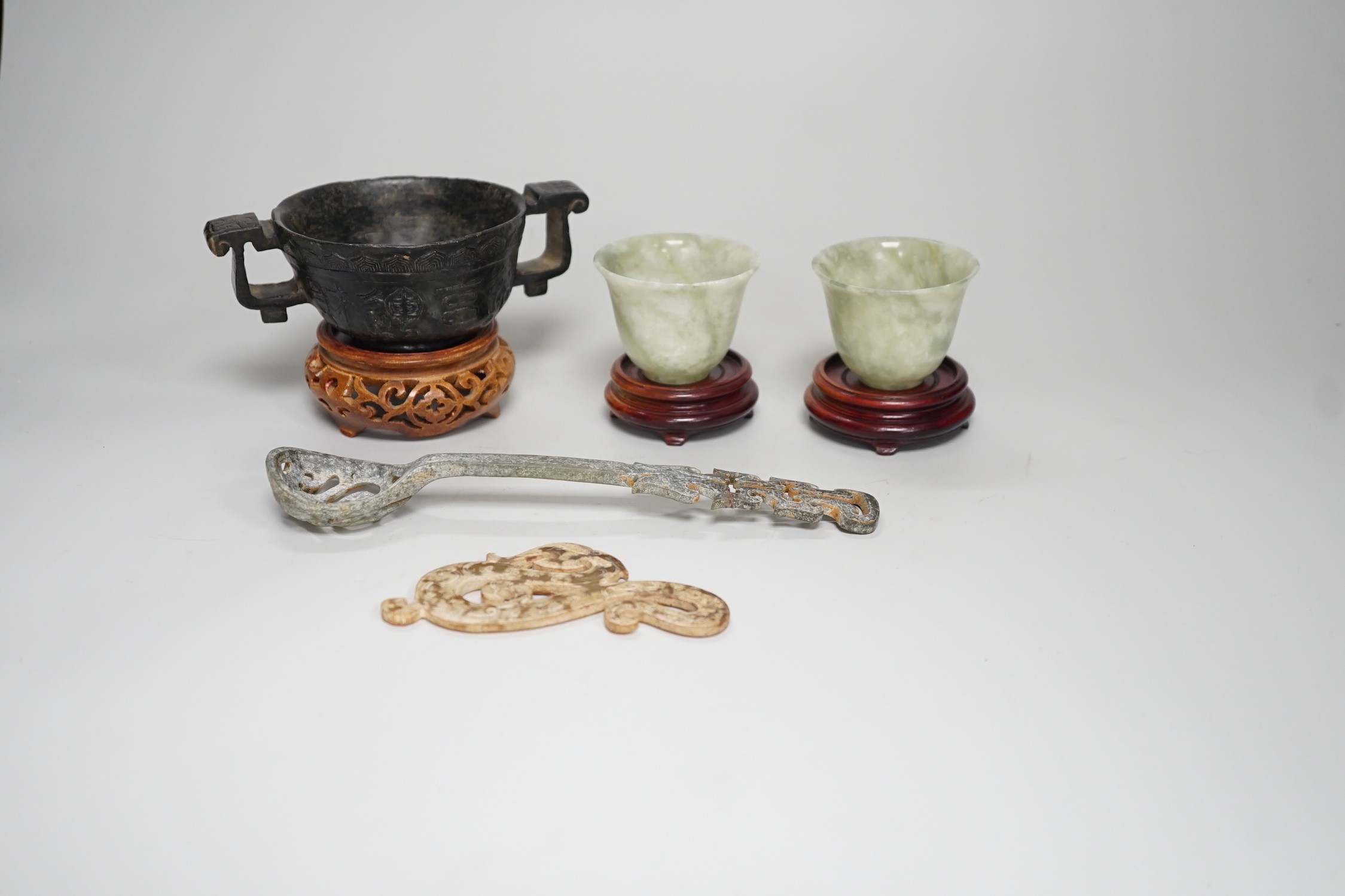 A selection of five Chinese archaistic hardstone carvings. Tallest 8cm including stand